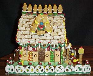 Janine did most of this side. Notice the gable, of which I am very proud! Julie added the icicles and the green garland along the roof.