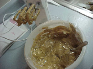 After everything cooled and dried, then we made lots of brown icing for mortar.