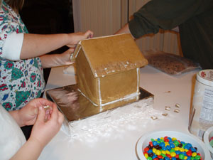 Starting to glue on the roof. This year's roofing material was wheat chex.