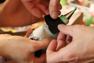 We had a lot of trouble with the green icing. Here we are patching an icing bag hernia with duct tape!!