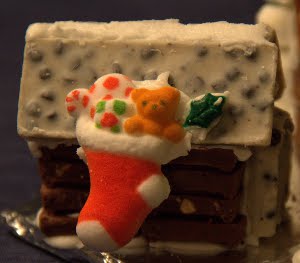 Shaya's dog house made of chocolate bars. The stocking is from a set of little items my mom bought from the cake decorating store this year.