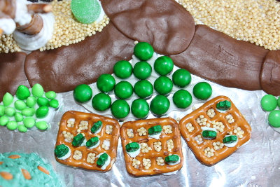 Bits of holly, green chocolate candies, and chocolate sunflower seeds.