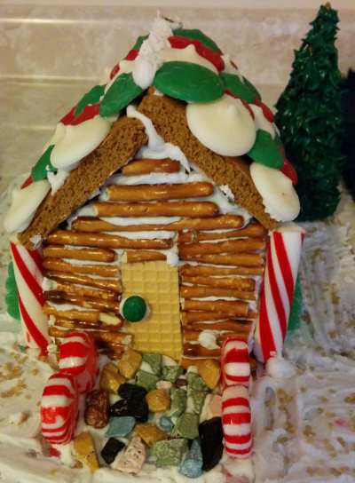 K & H's log cabin with chocolate rock path.