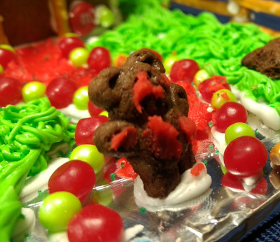 We had some store bought icing, which I thought would save time, but the packaging developed a hole quickly, which led to an incident with this teddy graham bear which didn't end well for the bear.